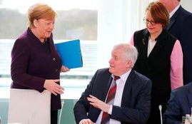 German Interior Minister Horst Seehofer refuses to shake the hand of German Chancellor Angela Merkel for hygienic reasons before a migration summit at the Chancellery in Berlin, Germany, March 2, 2020. REUTERS/Hannibal Hanschke TPX IMAGES OF THE DAY