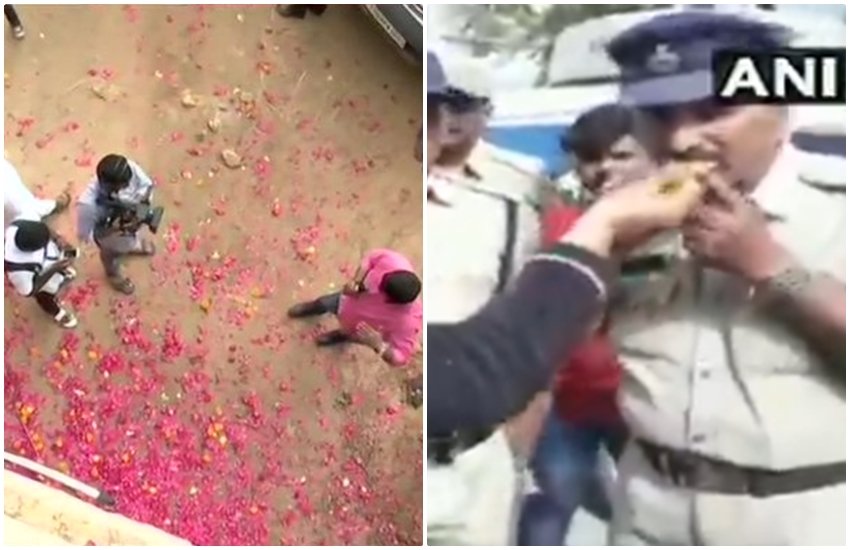 गैंग रेप के आरोपियों का एनकाउंटर करने वाली पुलिस पर बरसे फूल, बटीं मिठाइयां (pc - ANI)