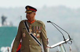 Pakistan's Army Chief of Staff General Qamar Javed Bajwa, walks as he arrives to attend the Pakistan Day military parade in Islamabad,