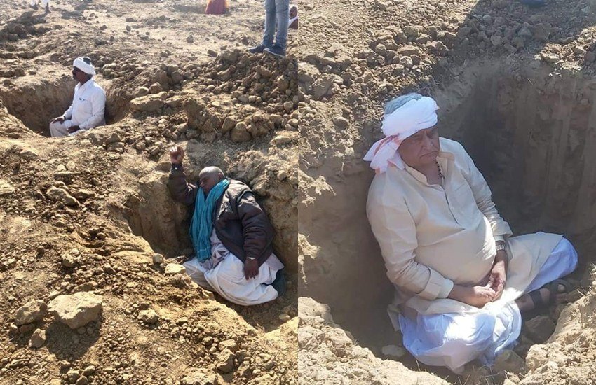 राजस्थान के दौसा जिले के नांगल राजवतान तहसील में आने वाले गांव लाड़ली का बांस में किसान अपने ही खेतों में समाधि लेने को मजबूर हैं। 100 से ज्यादा किसानों ने अपने ही खेतों में करीब तीन-तीन फीट गहरे और इतने ही चौड़े सौ से ज्यादा गड्ढे खोदे उनके अंदर बैठ गए। बीजेपी के राज्यसभा सांसद किरोड़ी लाल मीणा भी किसानों के इस प्रदर्शन में साथ देते हुए एक गड्ढे में बैठ हुए हैं। दरअसल किसान केंद्र सरकार के खिलाफ अपनी मांगों को लेकर आदोलन करते हुए समाधि में बैठे हैं। किसानों का कहना है कि यह 'समाधि सत्याग्रह' उस वक्त तक जारी रहेगा जब तक सरकार किसानों की मांग पर कोई सकारात्मक फैसला नहीं कर लेती। (All Photos: Ravish Kumar Facebook)