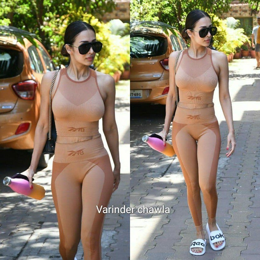 मलाइका अरोड़ा (Malaika Arora) बॉलीवुड की सबसे फिट अभिनेत्रियों में गिनी जाती हैं। 43 साल की हो चुकीं मलाइका आज भी अपनी फिटनेस पर वैसे ही ध्यान देती हैं जैसे कोई 20-22 साल की उम्र में देता है। वह नियमित तौर पर जिम जाती हैं। जिम के बाहर से उनकी तस्वीरें भी खूब वायरल होती हैं। मलाइका जितनी फिट हैं उतनी ही स्टायलिश भी हैं। बात जिम वियर की करें तो वह उसमें भी कमाल लगती हैं। हाल ही में जिम के बाहर से स्किन कलर के जिम वियर में मलाइका की कुछ तस्वीरें वायरल हुई हैं।