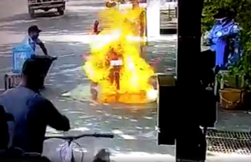 Spraying sanitizer in vehicles may catch fire, Spraying sanitizer is not safe in car, sanitizer use to avoid coronavirus, Bajaj commuter motorcycle catches fire, Bajaj Motorcycle catchs fire after using sanitizer