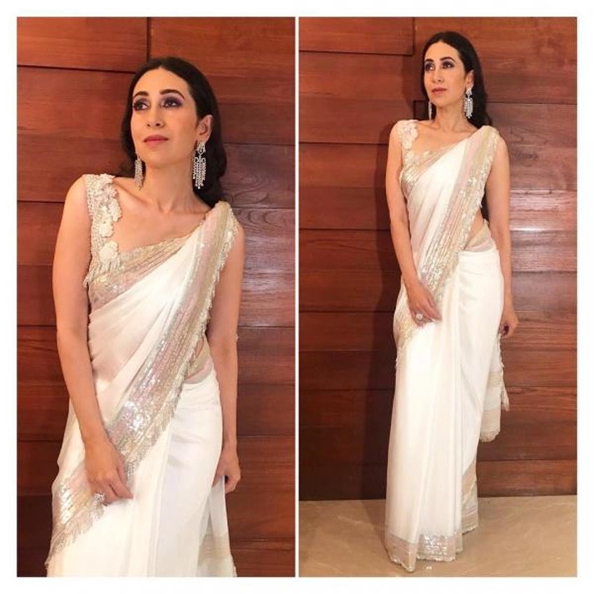 सोनम कपूर की शादी में करिश्मा मनीष मल्होत्रा की डिजाइन की गई इस साड़ी में बेहद खूबसूरत दिख रही थीं।