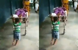 boy pushing stretcher