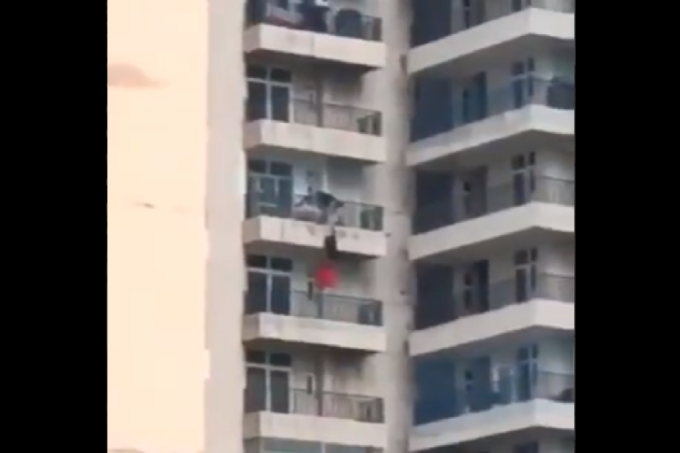 Video, Uttar Pradesh, Ghaziabad, Man holds woman, Hanging From Balcony, Woman falls