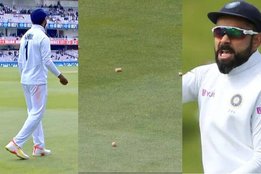 ind-vs-eng-beer-caps-thrown-over-kl-rahul-in-lords-and-virat-kohli-signals-to-throw-it-back-to-the-throwers-watch-video