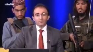 News Anchor surrounded by Talibani gunmen