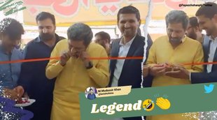 Fayyaz-ul-Hassan Chohan, Fayyaz-ul-Hassan Chohan bite ribbon, Fayyaz-ul-Hassan Chohan ribbon with teeth, pak minister cut ribbon teeth, viral video, pakistan news,