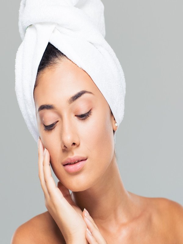 Portrait of a beautiful woman with towel on head