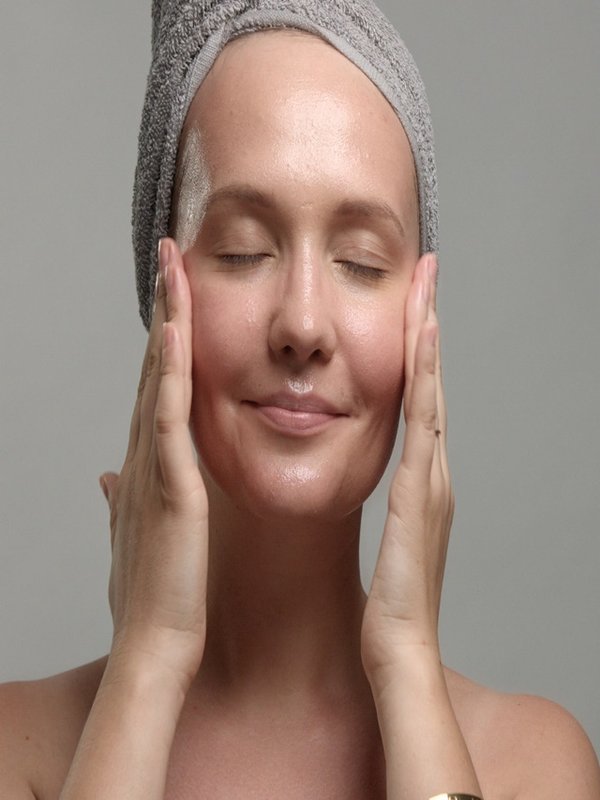 woman with a facial sheet mask on