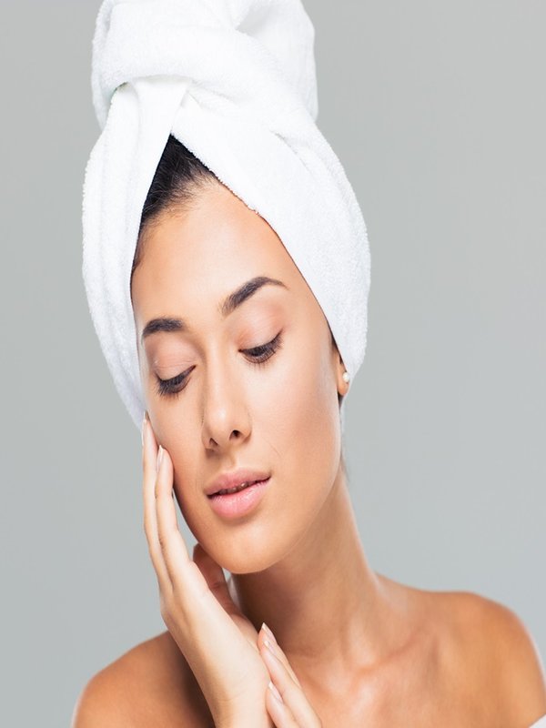 Portrait of a beautiful woman with towel on head