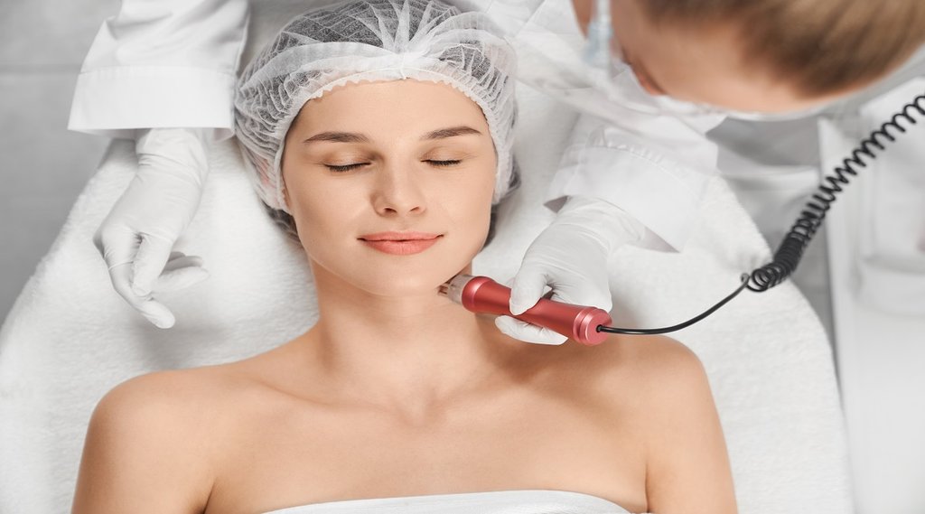 hydrafacial Woman enjoying procedure cleaning or massage for face.