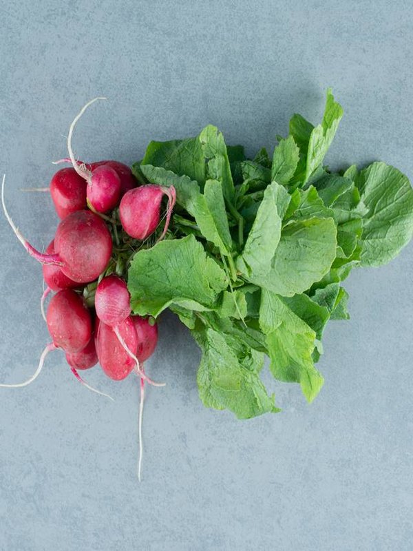 Fresh red turnips on marble background