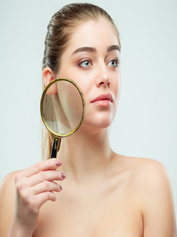 Beautiful Face of Young Woman with Clean Fresh Skin