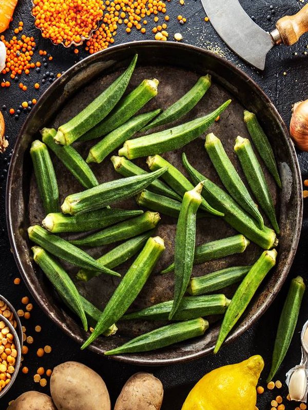 Variety of fresh tasty vegetables on dark background