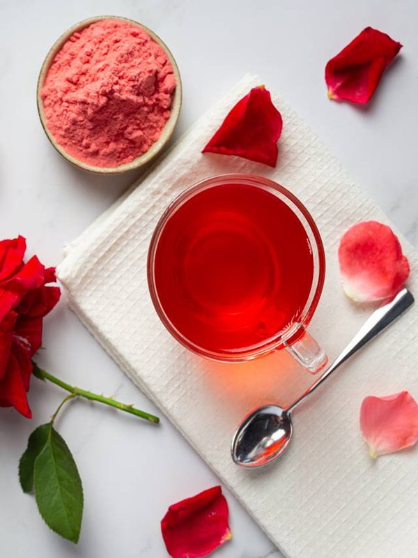 Hot rose tea on table