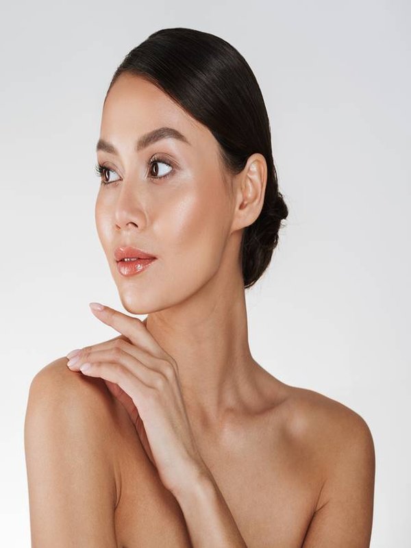 Beauty portrait of feminine young woman looking away and touchin