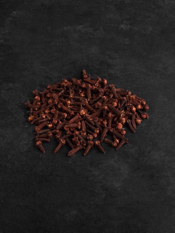 Dry cloves isolated on black background