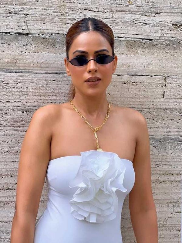NIA SHARMA IN WHITE OF SHOULDER DRESS