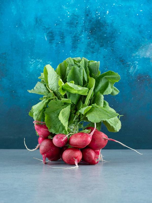 Fresh red turnips on marble background