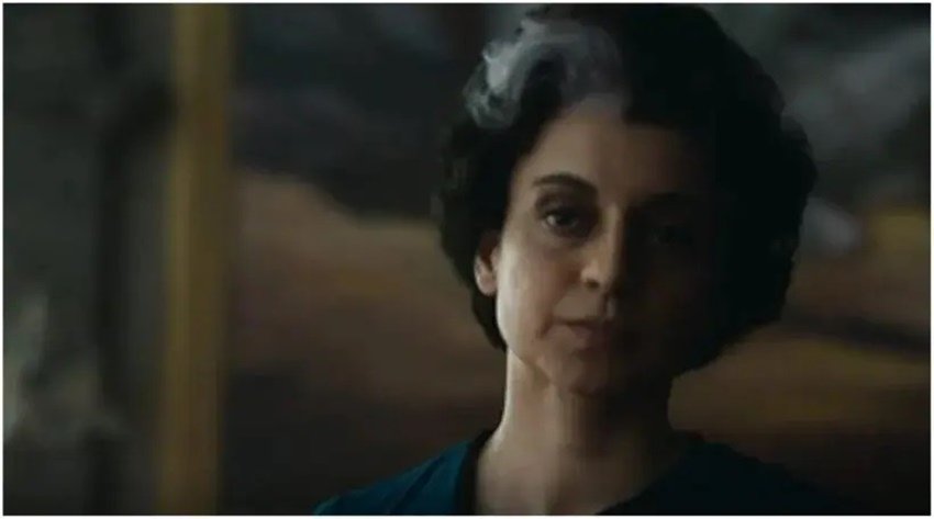 Emergency Teaser: बॉलीवुड एक्ट्रेस कंगना रनौत (Kangana Ranaut) अब बड़े पर्दे पर पूर्व प्रधानमंत्री इंदिरा गांधी (Ex PM Indira Gandhi) का किरदार निभाती नजर आएंगी। उनकी नई फिल्म 'इमरजेंसी' का फर्स्ट लुक (Emergency First Look) रिलीज हो चुका है और इसमें कंगना हुबहू इंदिरा गांधी (Kangana Ranaut as Indira Gandhi) की तरह ही नजर आ रही हैं। कंगना को इंदिरा गांधी का यह रूप विश्व के चर्चित प्रोस्थेटिक मेकअप आर्टिस्ट (Prosthetic Makeup Artist) ने दिया है। तो चलिए जानते हैं कि कौन है वह मेकअप आर्टिस्ट -