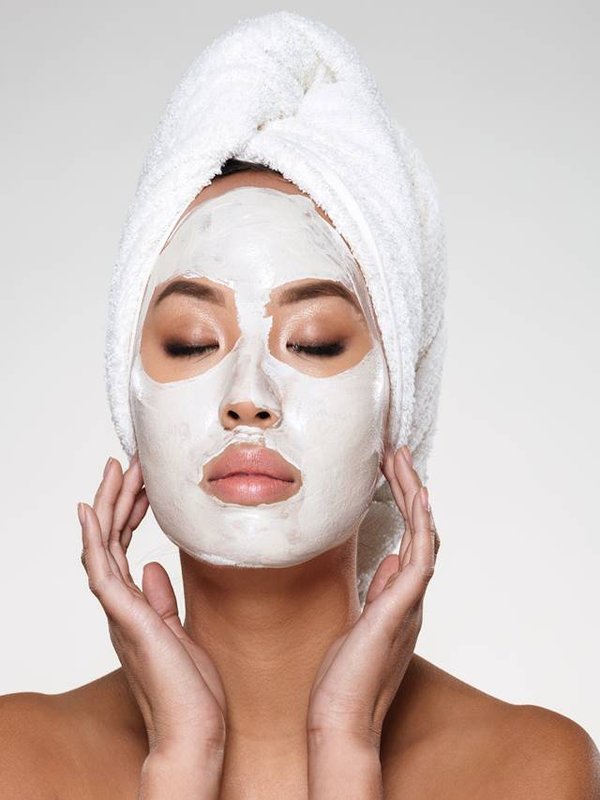 Portrait of beautiful lady with closed eyes put scrab on her face isolated