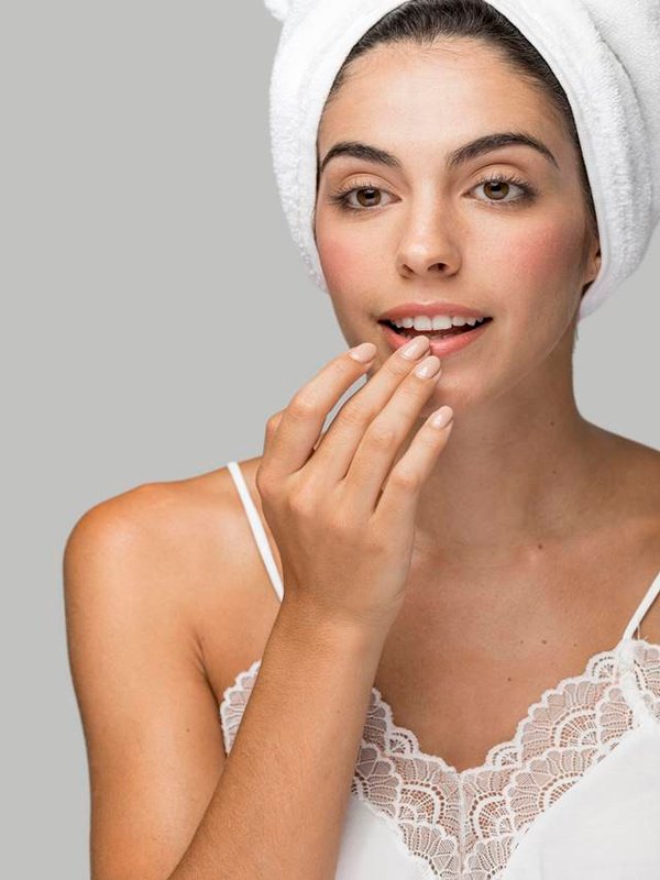 woman-applying-lip-balm