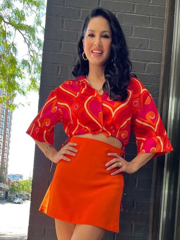 SUNNY LEONE IN ORANGE SKIRT STYLE