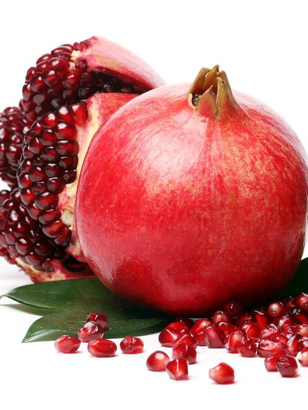 Exotic and delicious pomegranate on white background