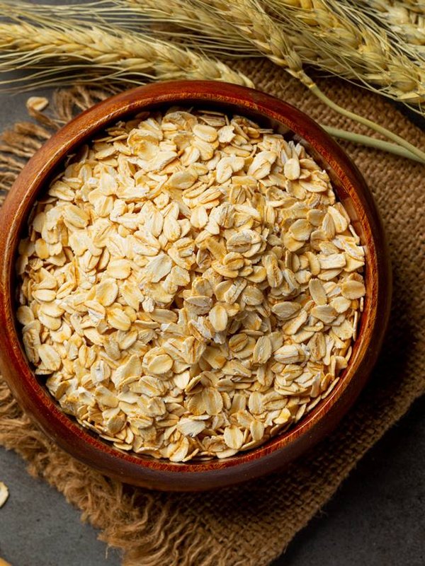 raw barley grain in old dark background