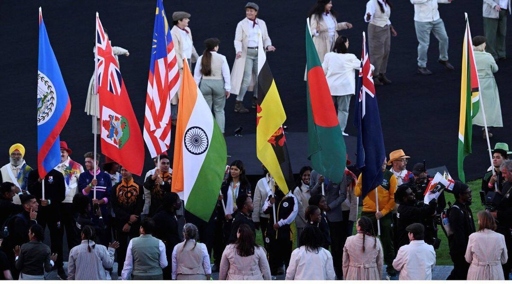 Flagbearers of participating countries hold the national flags of their respective countries during the closing ceremony of the Commonwealth Games 2022