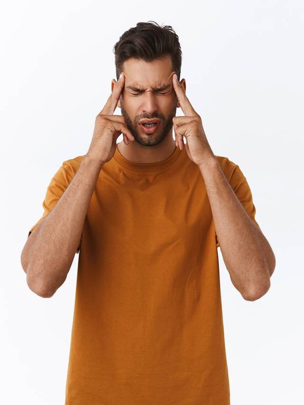 Upset and distressed, tensed young bearded guy suffering terribl