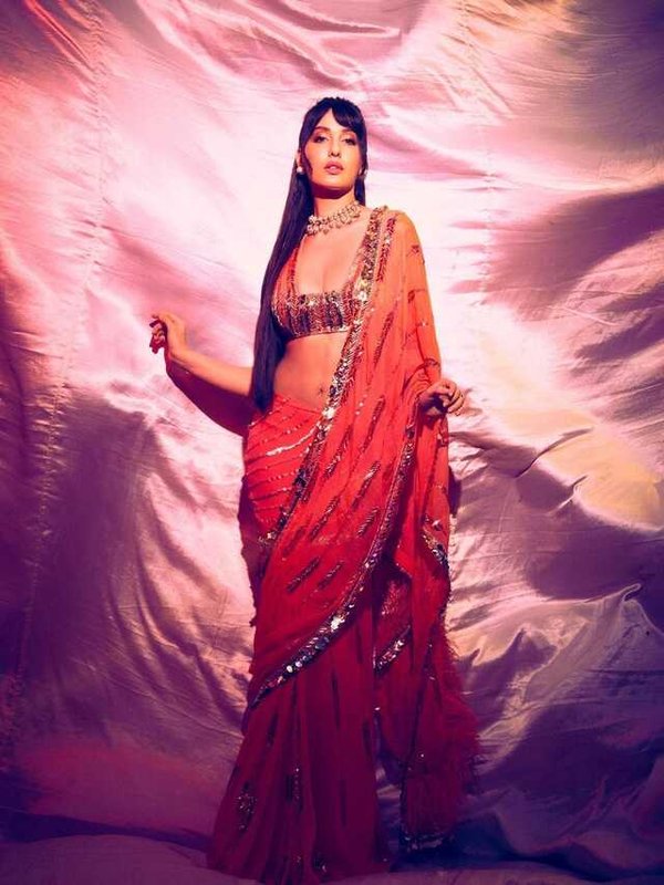 NORA FATEHI IN STUNNING RED SAREE LOOK