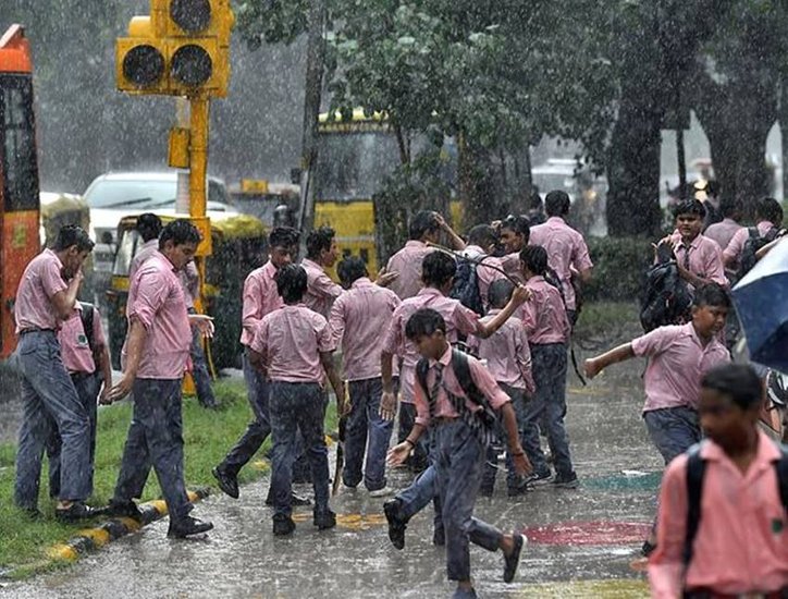 Heavy rains forced children to drenched after returning from school.