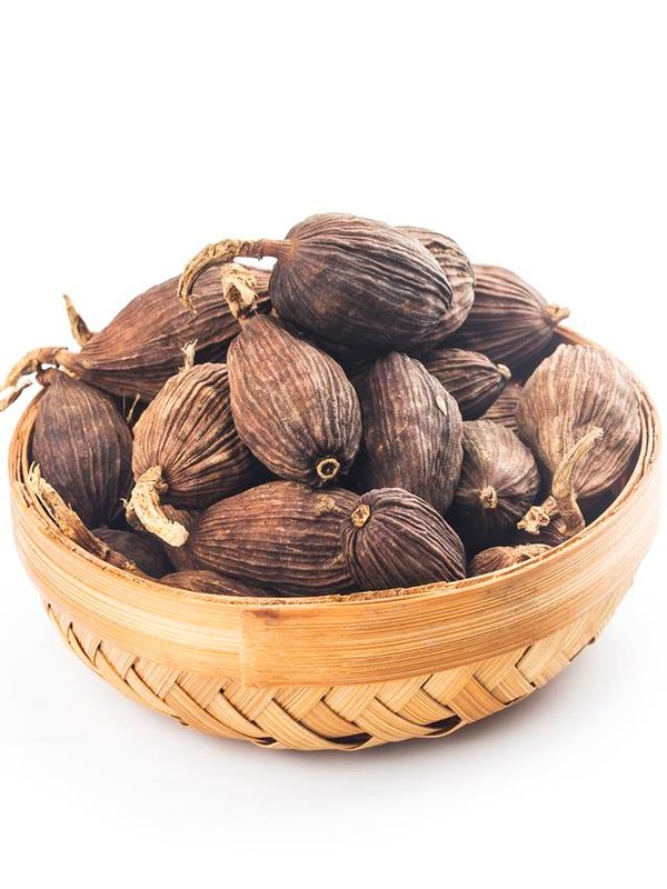 Black cardamom on a white background