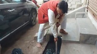 Pradhuman Singh Tomar cleans drain