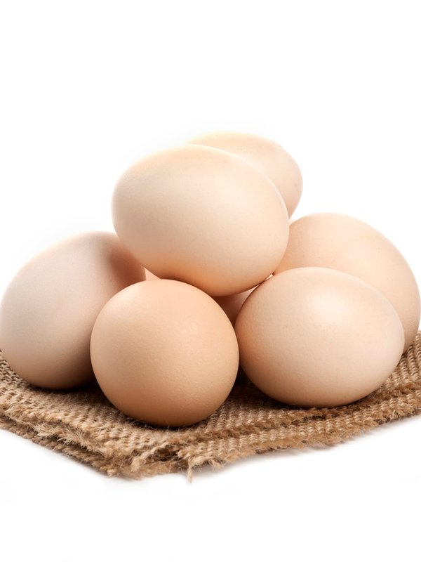Three fresh organic raw eggs isolated on white surface