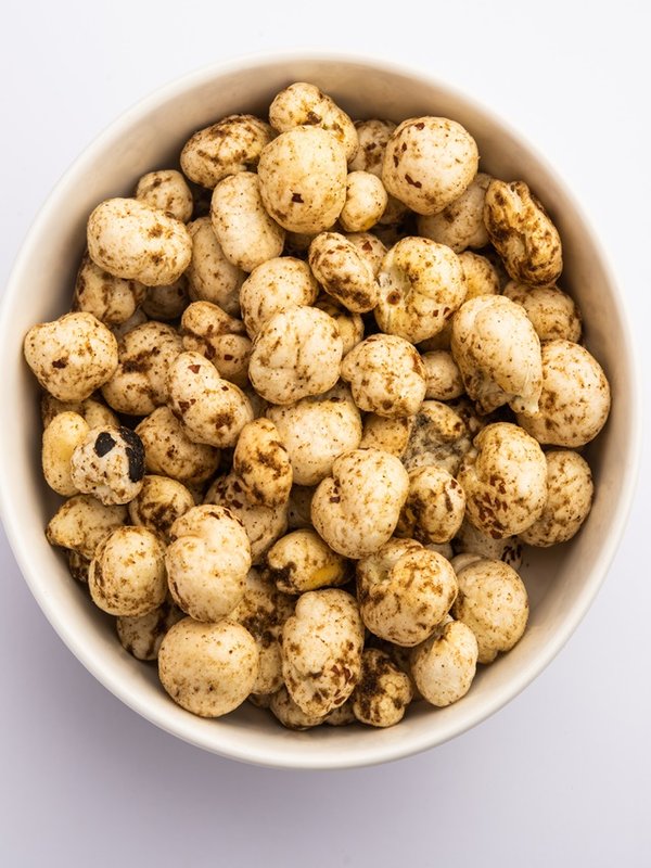 Roasted Phool Makhana or Crispy Masala Lotus pops Seed served in a bowl, selective focus