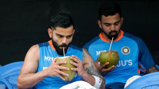 KL Rahul and Virat Kohli drink coconut water during a practice session