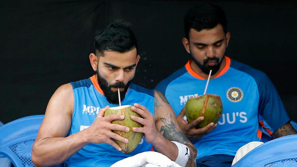 KL Rahul and Virat Kohli drink coconut water during a practice session