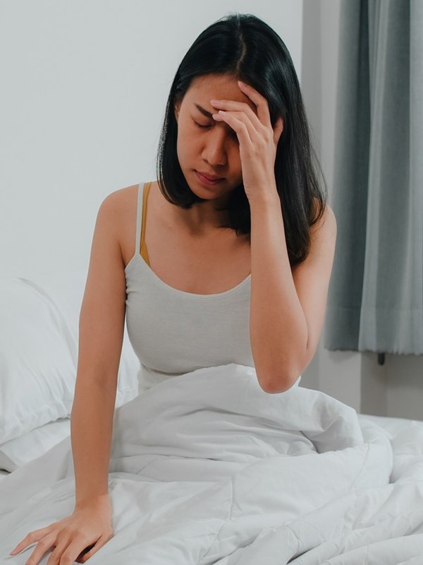 Unhealthy sick Indian female suffers from insomnia. Asian young