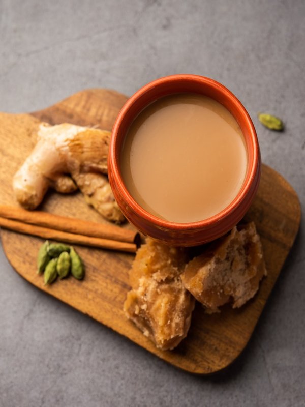 Jaggery tea or Gur ki chai with ingredients like gud, ginger or adrak, green cardamom and cinnamon