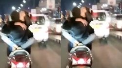 Lucknow Viral Video: चलती स्कूटी पर इश्क लड़ाते कपल का वीडियो वायरल, लोगों ने उठाये ऐसे सवाल