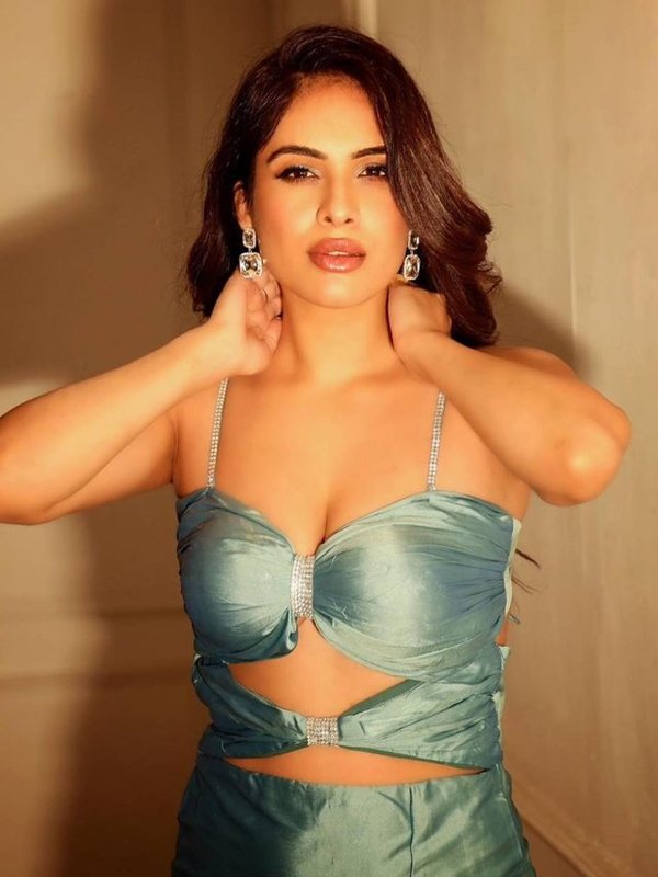 NEHA MALIK IN DEEP CUT DRESS