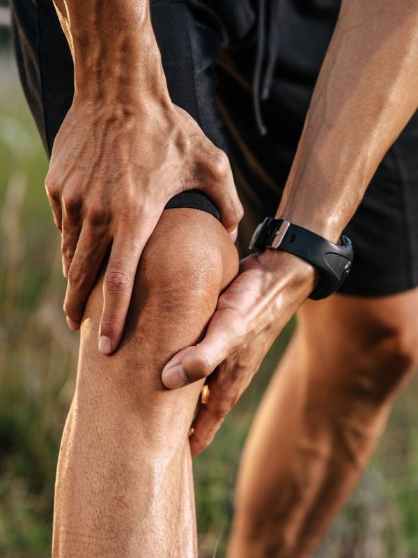 The man bent her head and grabbed him at her after exercise.