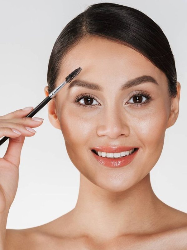 Beauty picture of pretty young woman with hair in bun looking on