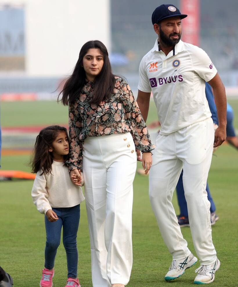 Cheteshwar Pujara with his wife and daughter