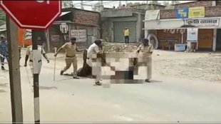 police drag dead body