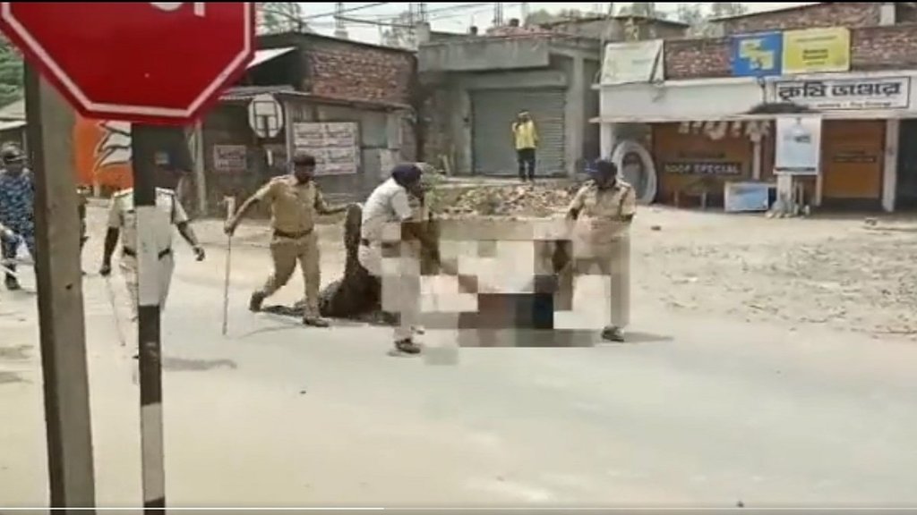 police drag dead body