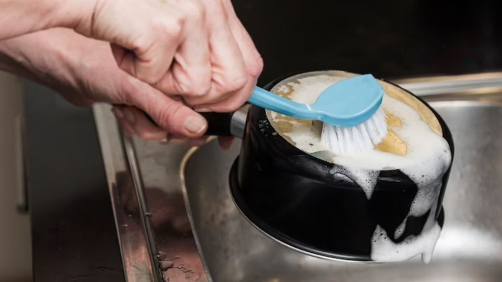 kadai cleaning spray, how to clean kadai bottom, how to clean kadai with vinegar, how to clean kadai with baking soda, how to clean kadai with harpic